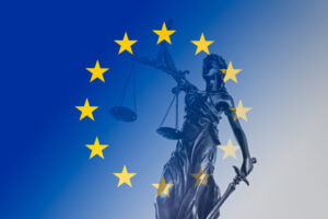 EU flag superimposed on statue with scales of justice, Digital Markets Act concept