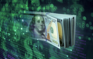 UK technology $4 trillion. Wad of dollar bills emerging out of binary code screen green on black